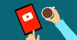Illustration of a hand tapping a tablet showing the YouTube logo