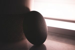 Smart speaker on a table in soft light