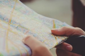 Hands holding an open street map