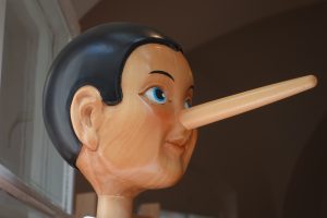 Pinocchio puppet with an extended long nose