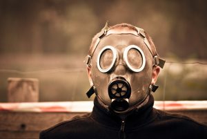 Person wearing a vintage gas mask