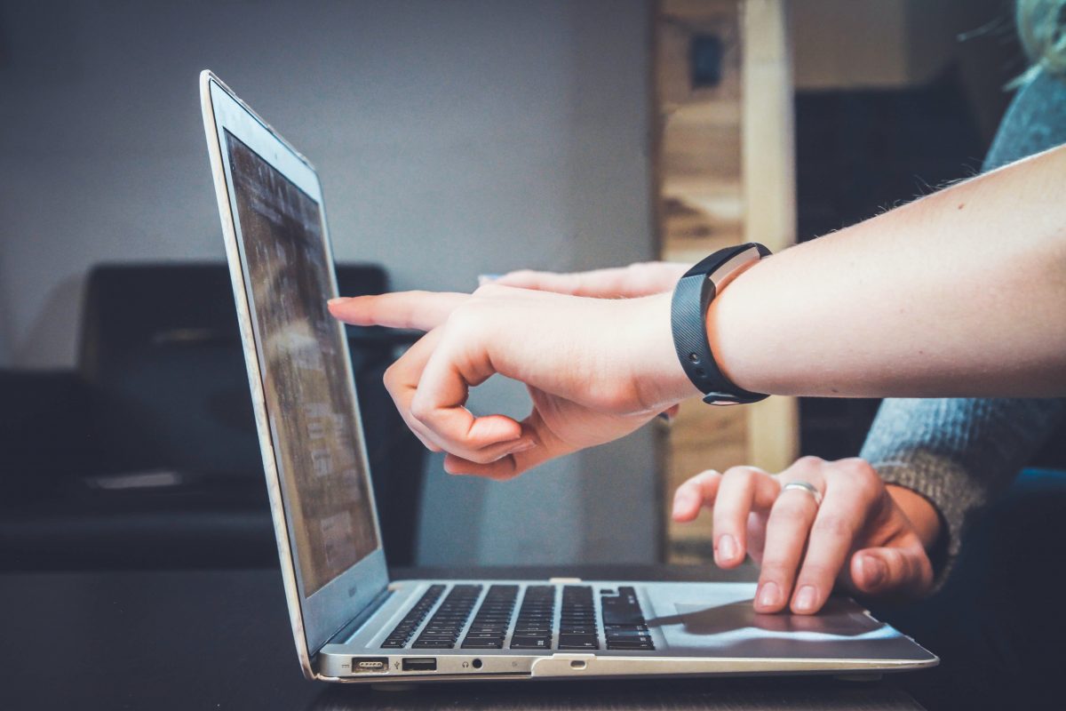 user pointing at computer screen